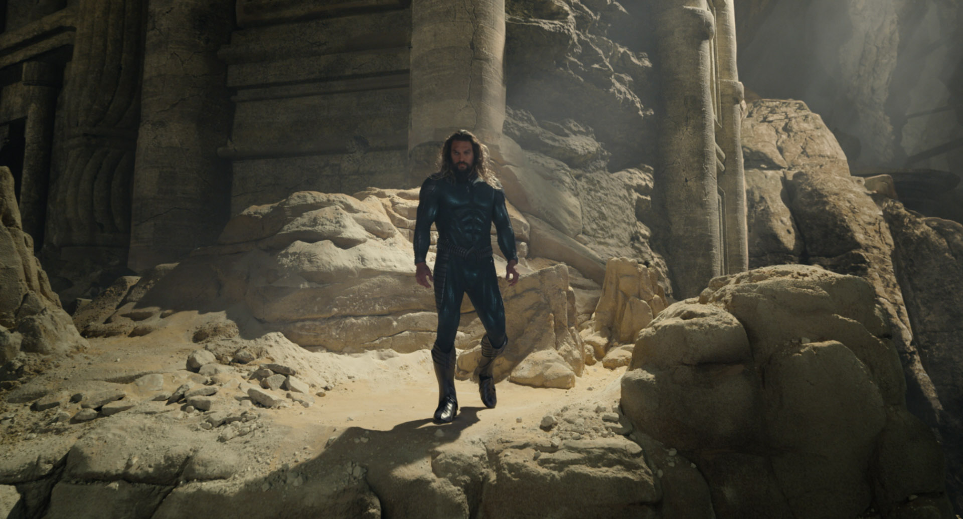 Aquaman stands in a cave