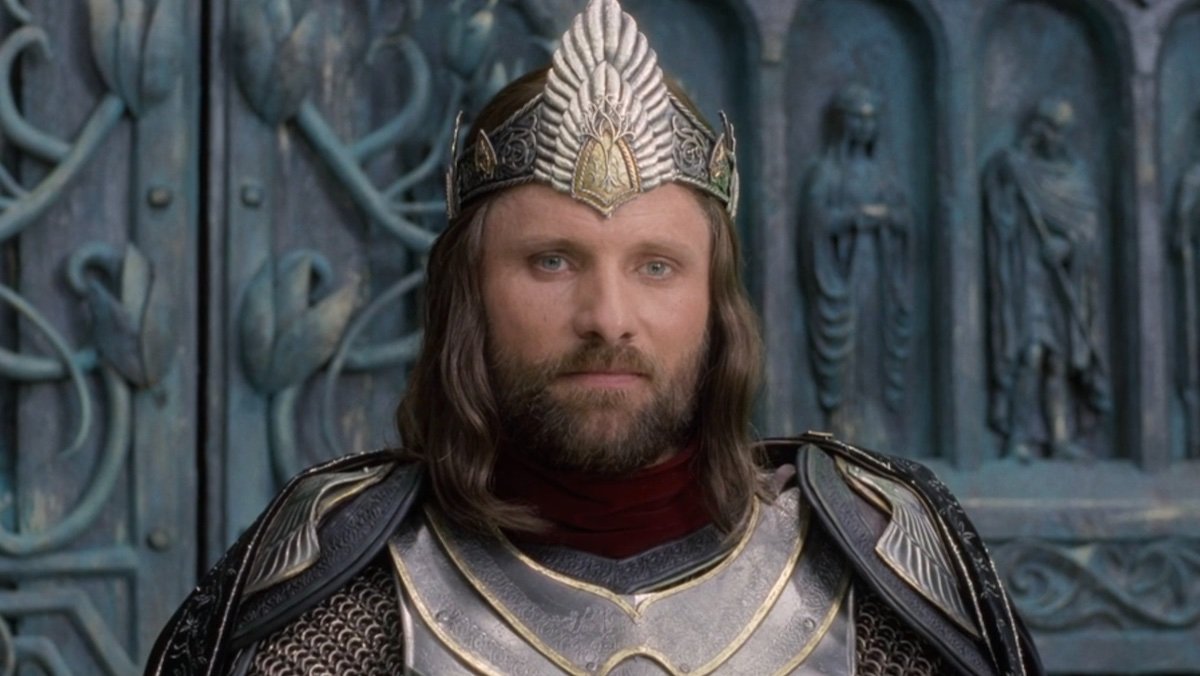 King Aragorn wears his crown in front of his subjects in The Lord of the Rings: The Return of the King