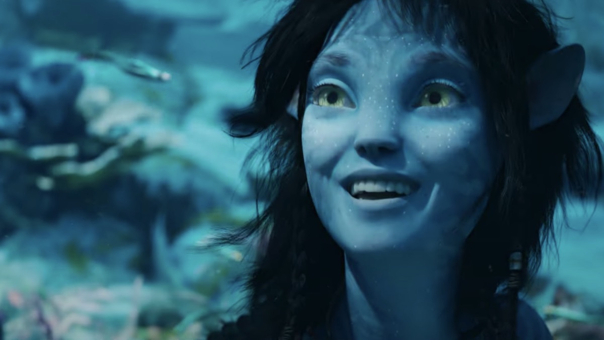 A Na'vi smiles while underwater in Avatar: The Way of Water