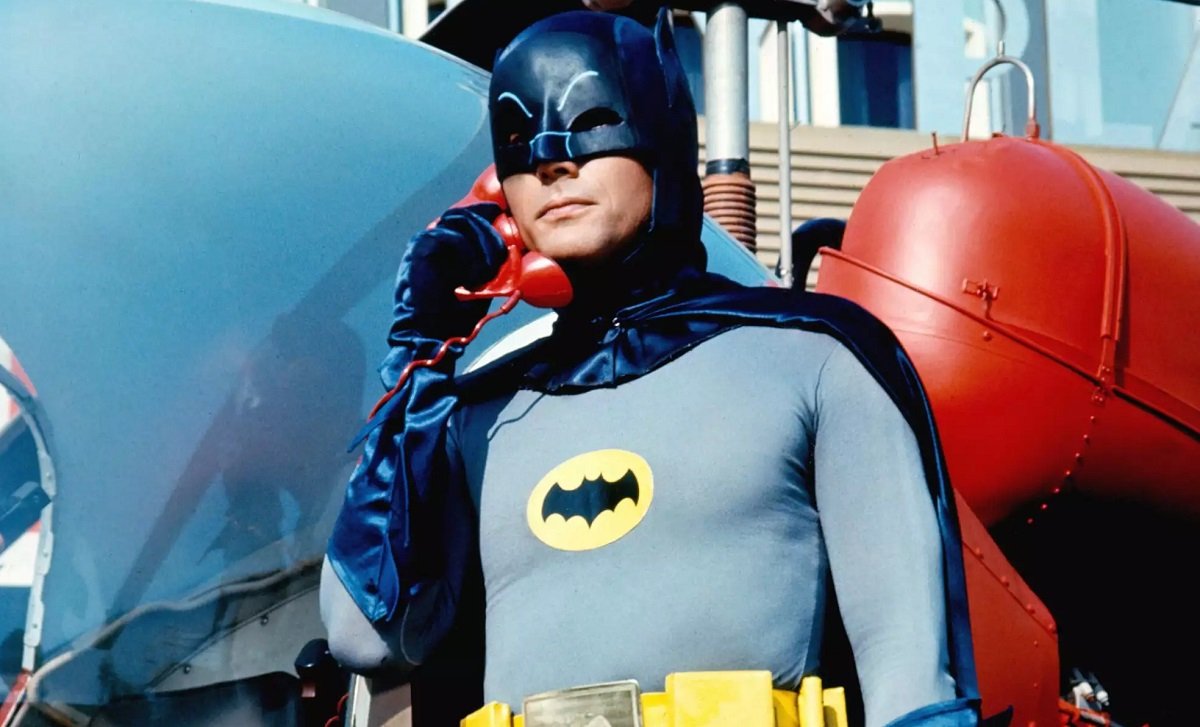Adam West as Batman, taking a call on the Bat phone, in the 1966 Batman TV show.