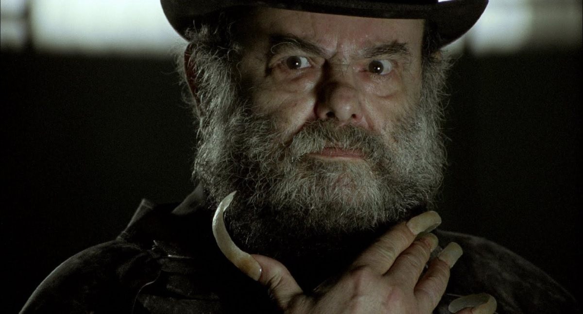 Jose Mojica Marins as Coffin Joe, with his trademark top hat and long, curly fingernails, in the 2008 movie Embodiment of Evil.