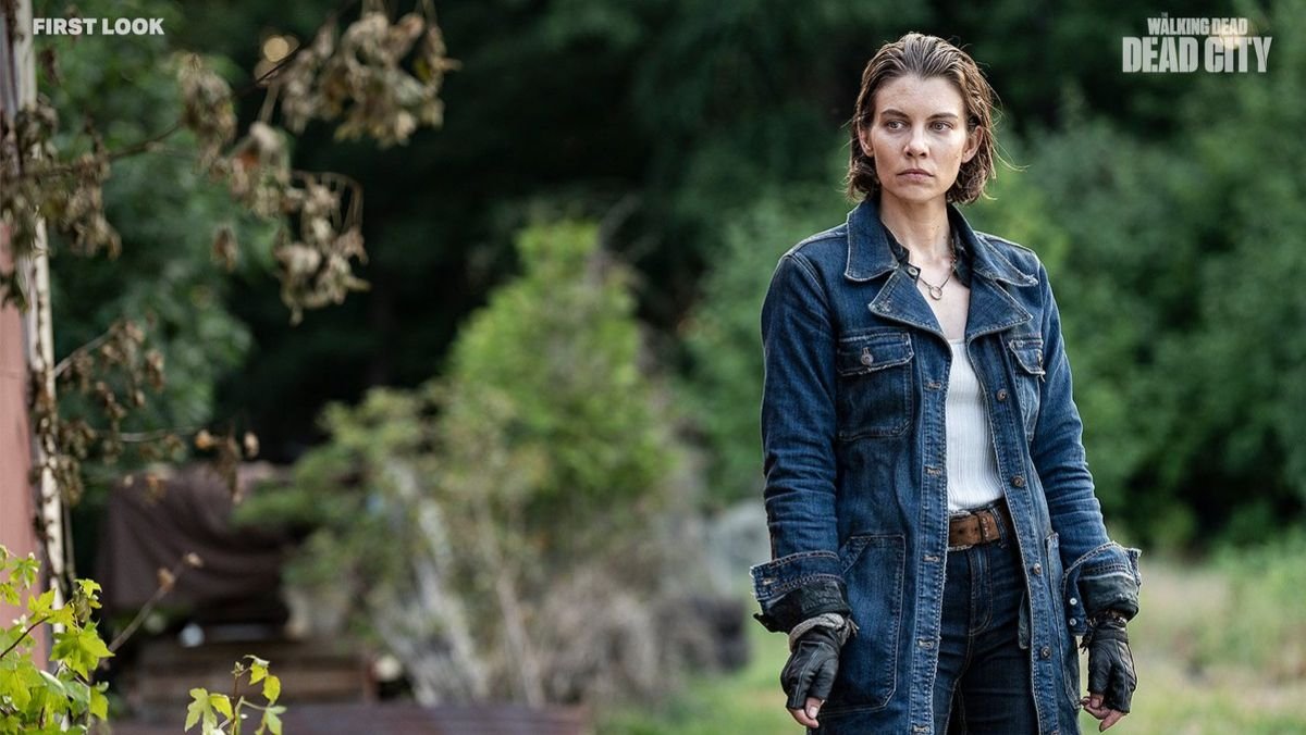 Maggie stands outside wearing a jean jacket in Dead City 