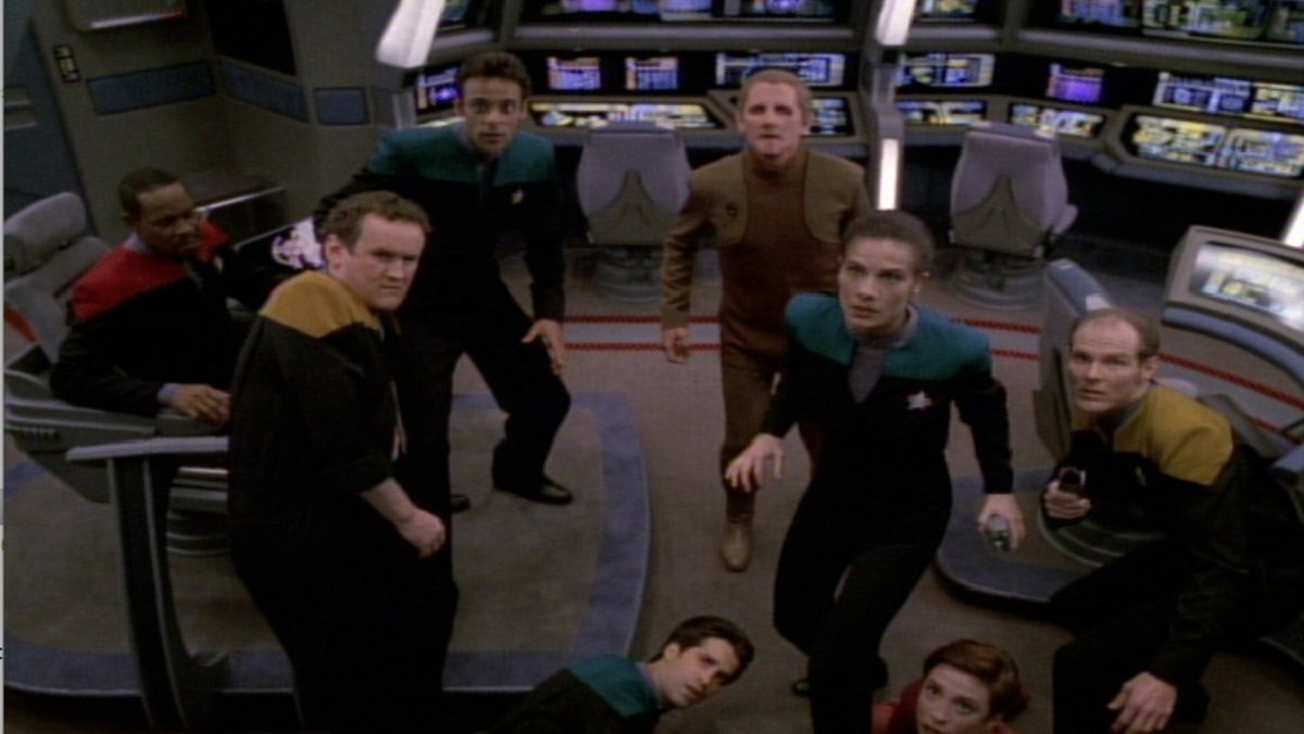 The crew of the Defiant faces of against a Changeling saboteur in the Deep Space Nine season 3 finale, The Adversary.