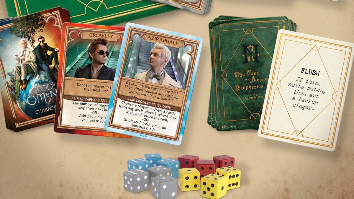 A spread of cards and dice for the Good Omens card game