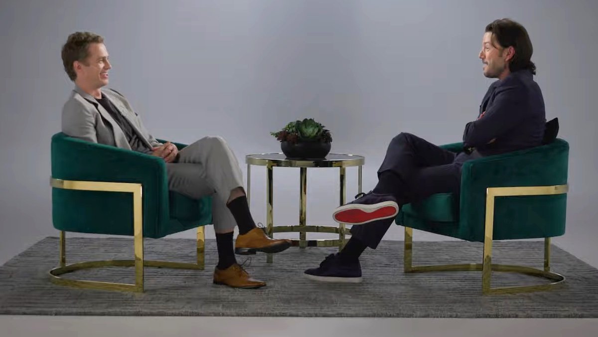 Hayden Christensen and Diego Luna sit opposite each other in chairs