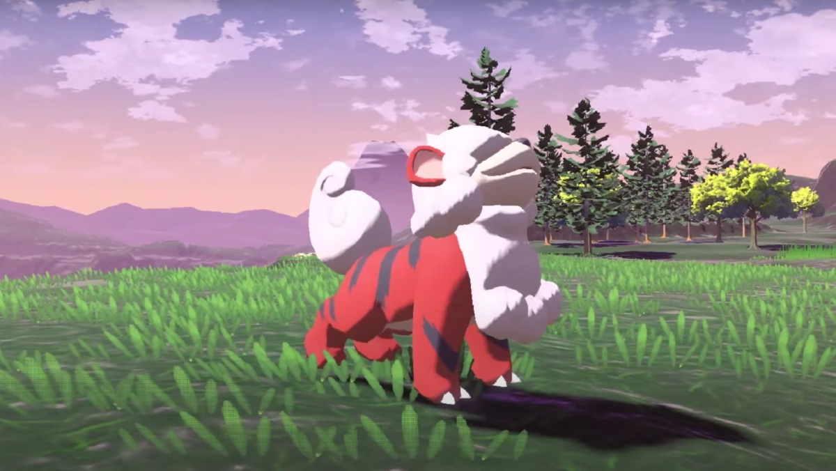 New Pokémon Legends: Arceus Regional form, the Hisuian Growlithe - a red, dog-like creature smiling in the grass