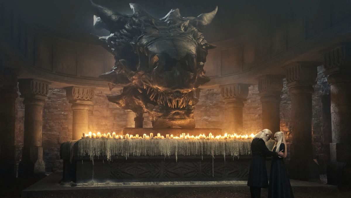 Rhaenyra and Viserys talk under the skull of the dragon Balerion in house of the dragon
