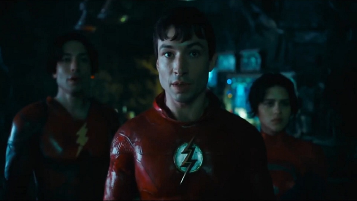 The Flash (Ezra Miller) is joined by an alternate Barry Allen and Supergrl in the Batcave.