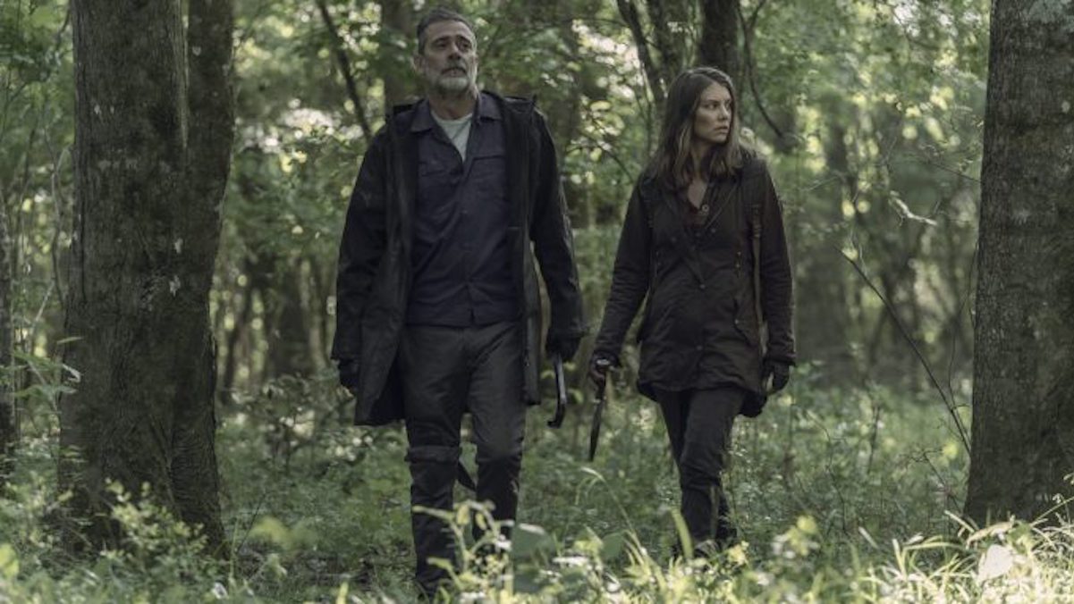 photo of Negan and Maggie from The Walking Dead going through woods